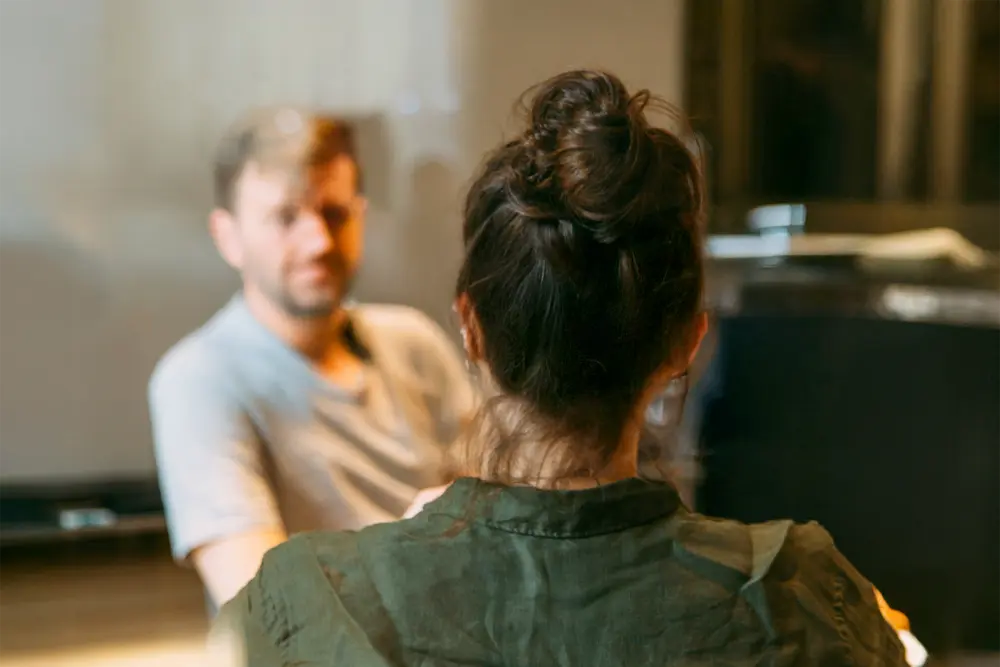 Man getting coached by woman
